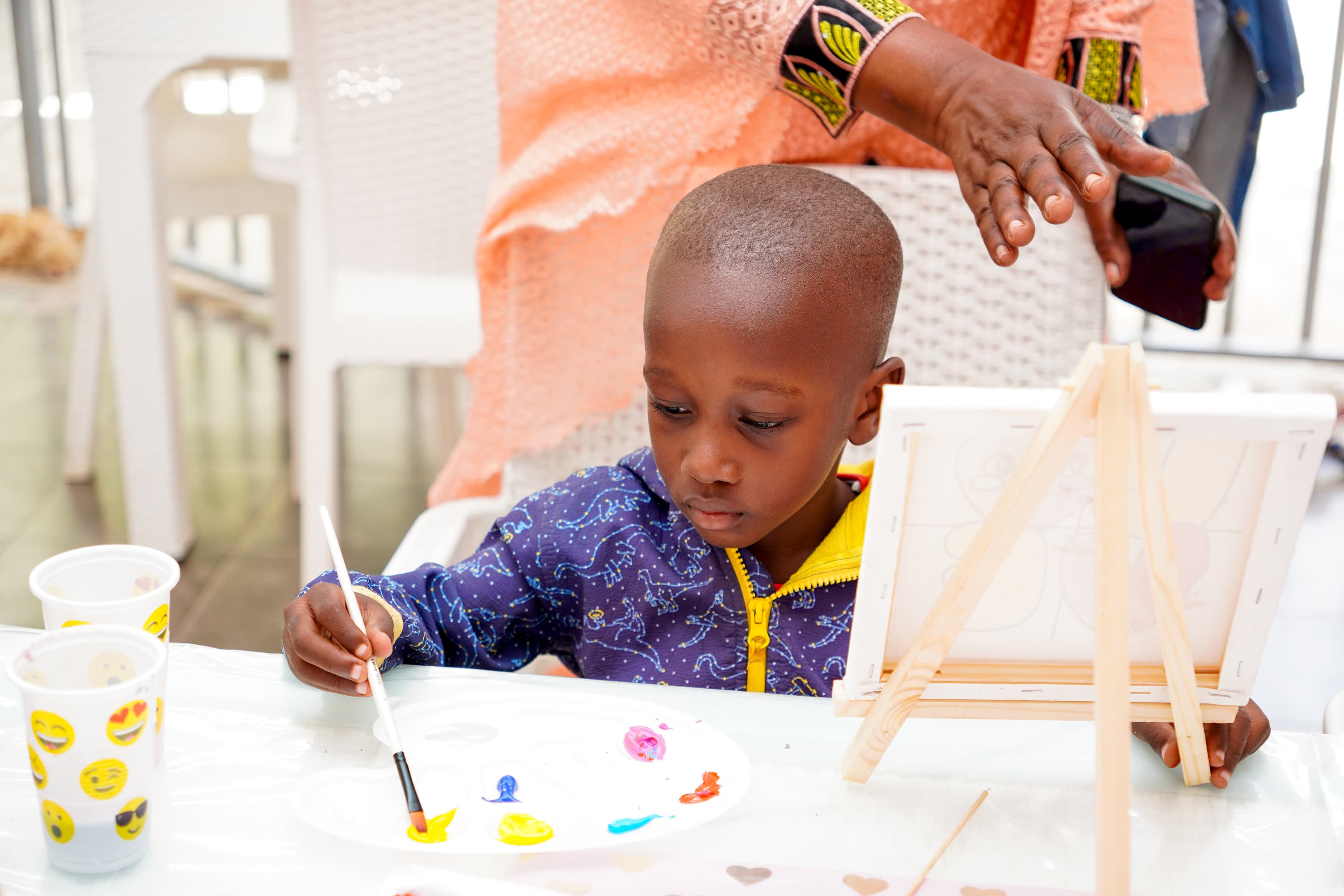 Teacher Rita supporting children in the classroom